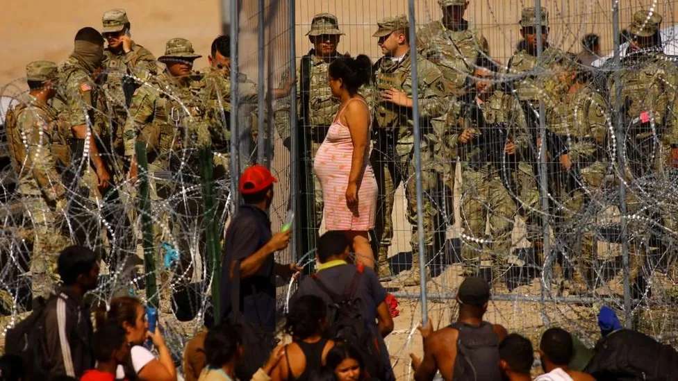 Biden approves new section of border wall as Mexico crossings rise