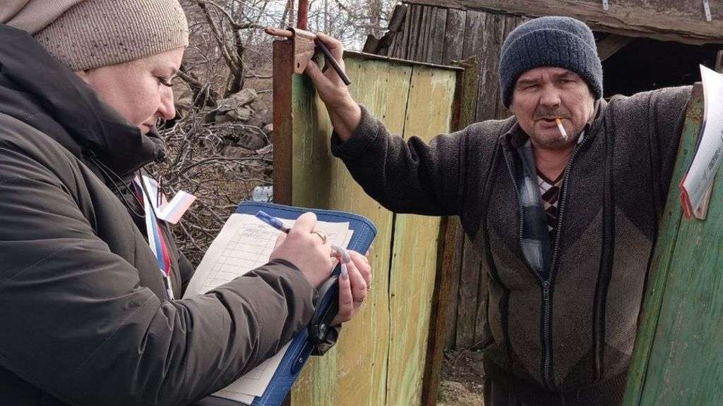 Occupied Ukraine encouraged to vote in Russian election by armed men