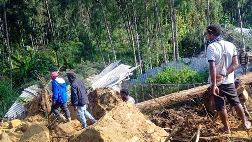 Race to rescue villagers trapped after deadly landslide