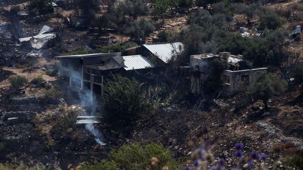 Hezbollah fires dozens of rockets into Israel after strike kills commander